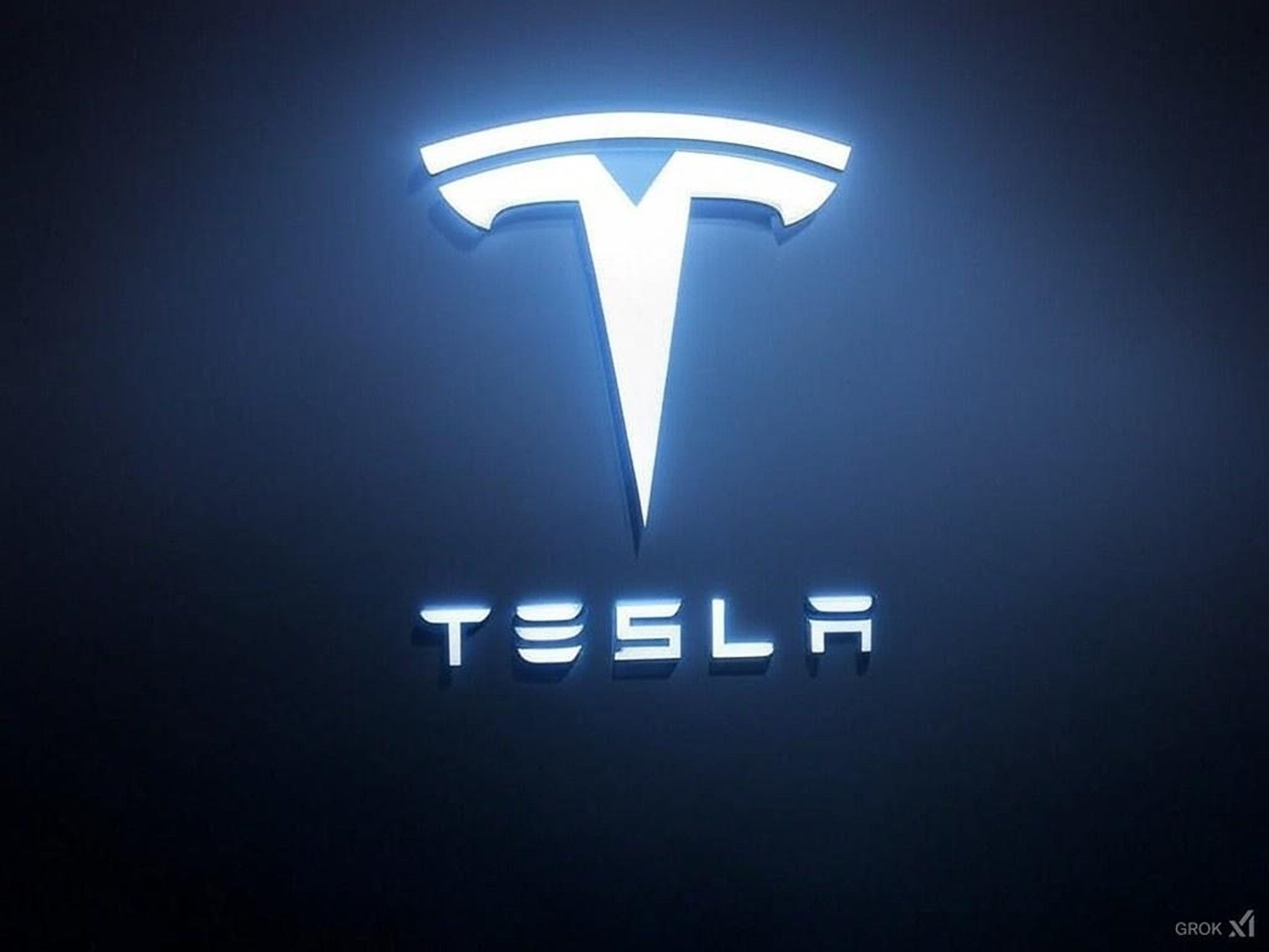 Leuchtendes Tesla-Logo vor dunklem Hintergrund.